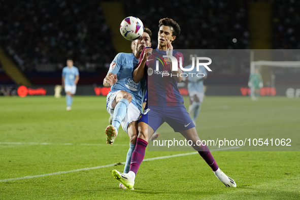 Ferran Torres left winger of Barcelona and Spain and Unai Nuñez centre-Back of Celta de Vigo and Spain compete for the ball during the LaLig...