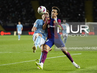 Ferran Torres left winger of Barcelona and Spain and Unai Nuñez centre-Back of Celta de Vigo and Spain compete for the ball during the LaLig...