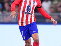 Antoine Griezmann of Atletico de Madrid Jose' Machin Dicombo of AC Monza during the UEFA Champions League Group E match between SS Lazio v A...