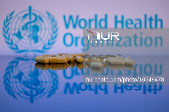 World Health Organization (WHO) displayed on screen with pharmacy close-up of various pills. Seen in this photo illustration, in Brussels, B...