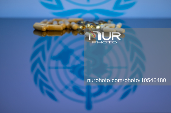 World Health Organization (WHO) displayed on screen with pharmacy close-up of various pills. Seen in this photo illustration, in Brussels, B...