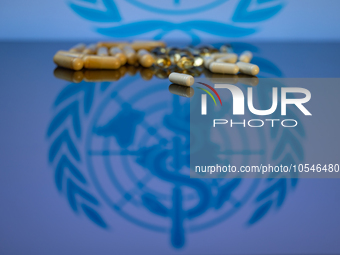 World Health Organization (WHO) displayed on screen with pharmacy close-up of various pills. Seen in this photo illustration, in Brussels, B...