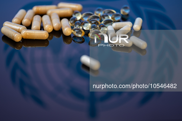 World Health Organization (WHO) displayed on screen with pharmacy close-up of various pills. Seen in this photo illustration, in Brussels, B...