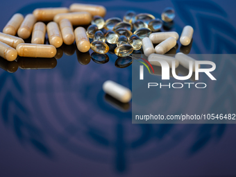 World Health Organization (WHO) displayed on screen with pharmacy close-up of various pills. Seen in this photo illustration, in Brussels, B...