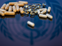 World Health Organization (WHO) displayed on screen with pharmacy close-up of various pills. Seen in this photo illustration, in Brussels, B...