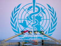 World Health Organization (WHO) displayed on screen with pharmacy medical syringe and vaccine vial. Seen in this photo illustration, in Brus...