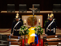 Colombian police and presidential guards guard as the late Colombian artist Fernando Botero lies inside the National Congress during his wak...