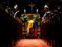 Colombian police and presidential guards guard as the late Colombian artist Fernando Botero lies inside the National Congress during his wak...