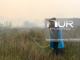 A man in Soak Batok Village, North Indralaya District, Ogan Ilir Regency, South Sumatra is extinguishing forest and land fires on Monday, Se...