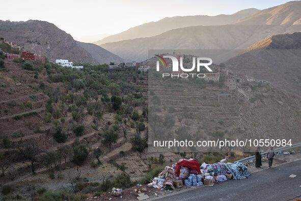 On the outskirts of the village of Ighil in Morocco, on September 14, 2023, provisions and clothing are being left by the roadside for the v...