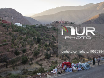 On the outskirts of the village of Ighil in Morocco, on September 14, 2023, provisions and clothing are being left by the roadside for the v...