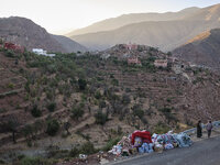 On the outskirts of the village of Ighil in Morocco, on September 14, 2023, provisions and clothing are being left by the roadside for the v...