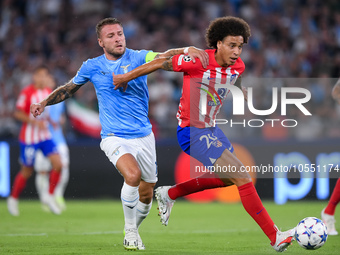 Axel Witsel of Atletico de Madrid and Ciro Immobile of SS Lazio compete for the ball during the UEFA Champions League Group E match between...