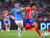 Axel Witsel of Atletico de Madrid and Ciro Immobile of SS Lazio compete for the ball during the UEFA Champions League Group E match between...