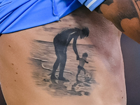 Close up of Ciro Immobile of SS Lazio chest tattoo during the UEFA Champions League Group E match between SS Lazio v Atletico de Madrid at S...