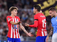 Pablo Barrios of Atletico de Madrid talks to Alvaro Morata of Atletico de Madrid during the UEFA Champions League Group E match between SS L...