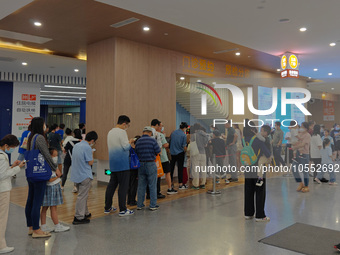 Patients line up for an emergency pre-check at the new pediatric building of Xinhua Hospital in Shanghai, China, On the night of September 2...