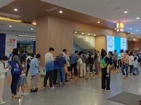 Patients line up for an emergency pre-check at the new pediatric building of Xinhua Hospital in Shanghai, China, On the night of September 2...