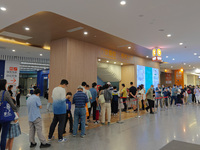 Patients line up for an emergency pre-check at the new pediatric building of Xinhua Hospital in Shanghai, China, On the night of September 2...