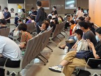 Patients line up for an emergency pre-check at the new pediatric building of Xinhua Hospital in Shanghai, China, On the night of September 2...