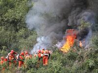 CHENGDE, CHINA - SEPTEMBER 25, 2023 - Firefighters perform a fire fighting drill in a forest area in Chengde, Hebei Province, China, Sept 25...