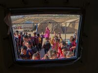 Photos taken on September 30, 2023, show Syrian students attending the first day of the new school year at a makeshift school inside a camp...