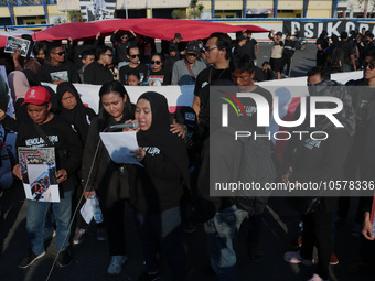 Hundreds of family members of tragedy victims read demands for legal justice to the Indonesian government in front of the stadium, during co...