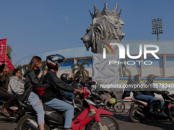 Thousands of Arema FC supporters are currently forming a convoy in front of a lion statue, the mascot of the Arema Club, on the first annive...