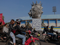 Thousands of Arema FC supporters are currently forming a convoy in front of a lion statue, the mascot of the Arema Club, on the first annive...