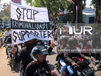 Thousands of Arema FC supporters convoy on the streets, during the 1st anniversary of the Kanjuruhan tragedy which killed 135 football suppo...