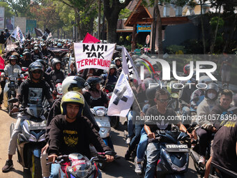 Thousands of Arema FC supporters convoy on the streets, during the 1st anniversary of the Kanjuruhan tragedy which killed 135 football suppo...