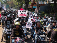 Thousands of Arema FC supporters convoy on the streets, during the 1st anniversary of the Kanjuruhan tragedy which killed 135 football suppo...