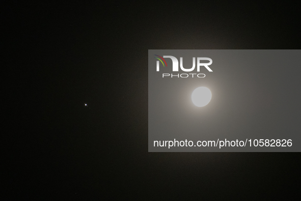 Conjunction between Moon and Jupiter planet is seen from L'Aquila, Italy, on October 1st, 2023. Jupiter and the Moon appeared to be very clo...