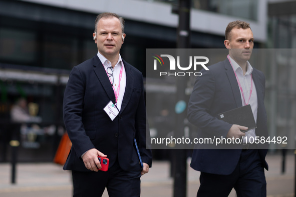 Sir Craig Oliver with an aide during the Conservative Party Conference at Manchester Central Convention Complex, Manchester on Monday 2nd Oc...