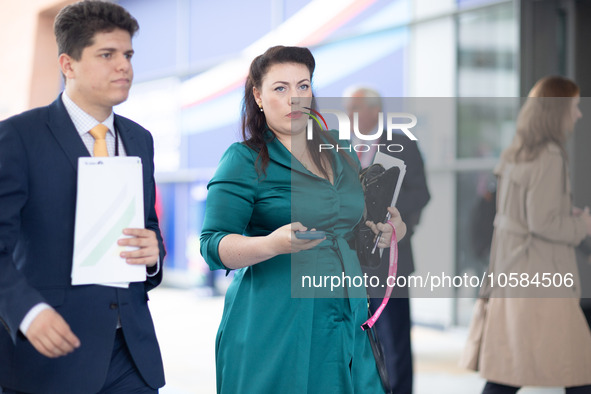 Alicia Kearns MP, with matching outfit and phone case, during the Conservative Party Conference at Manchester Central Convention Complex, Ma...