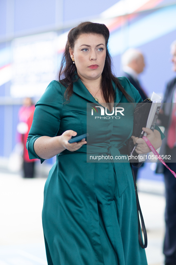 Alicia Kearns MP, with matching outfit and phone case, during the Conservative Party Conference at Manchester Central Convention Complex, Ma...