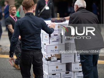 Another crate of Champagne Pol Roger - favoured by Winston Churchill - is wheeled into the Midland Hotel during the Conservative Party Confe...