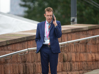 Andy Street, the Mayor of the West Midlands, on his phone during the Conservative Party Conference at Manchester Central Convention Complex,...