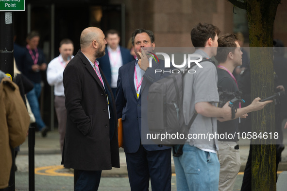 Harry Cole, political editor of The Sun, talks to Henry Hill of Conservative Home, as Owen Jones tries to interview delegatesduring the Cons...