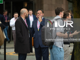 Harry Cole, political editor of The Sun, talks to Henry Hill of Conservative Home, as Owen Jones tries to interview delegatesduring the Cons...