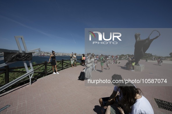 Several tourists are seen walking around the vicinity of the monument of Christ the King, in Almada, Lisbon. 04 September 2023. The National...