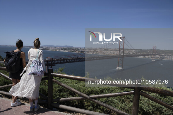 Tourists are seen walking around the vicinity of the viewpoint near the monument of Christ the King in Almada, Lisbon. 04 September 2023. Th...