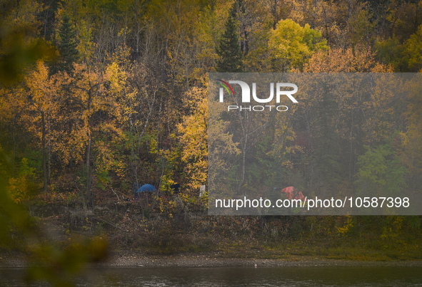 EDMONTON, CANADA - SEPTEMBER 29, 2023:
Two tents of rough sleepers along Saskatchewan River, on September 29, 2023, in Edmonton, Alberta, Ca...