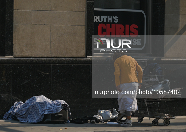 EDMONTON, CANADA - SEPTEMBER 29, 2023:
A homeless woman on the street in downtown Edmonton, on September 29, 2023, in Edmonton, Alberta, Can...