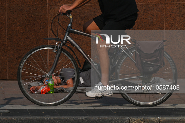 EDMONTON, CANADA - SEPTEMBER 29, 2023:
A homeless woman sleeping on the street in downtown Edmonton, on September 29, 2023, in Edmonton, Alb...