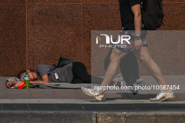 EDMONTON, CANADA - SEPTEMBER 29, 2023:
A homeless woman sleeping on the street in downtown Edmonton, on September 29, 2023, in Edmonton, Alb...