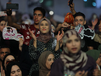 Students from the University of Al-aqsa celebrate graduation during an annual ceremony, in Khan Yunis in the southern Gaza Strip, on October...