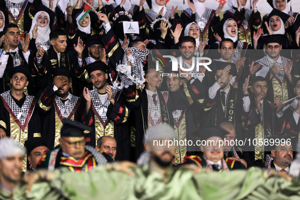 Students from the University of Al-aqsa celebrate graduation during an annual ceremony, in Khan Yunis in the southern Gaza Strip, on October...