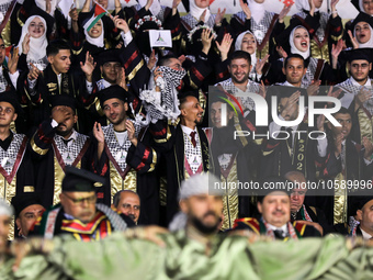 Students from the University of Al-aqsa celebrate graduation during an annual ceremony, in Khan Yunis in the southern Gaza Strip, on October...