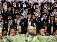 Students from the University of Al-aqsa celebrate graduation during an annual ceremony, in Khan Yunis in the southern Gaza Strip, on October...